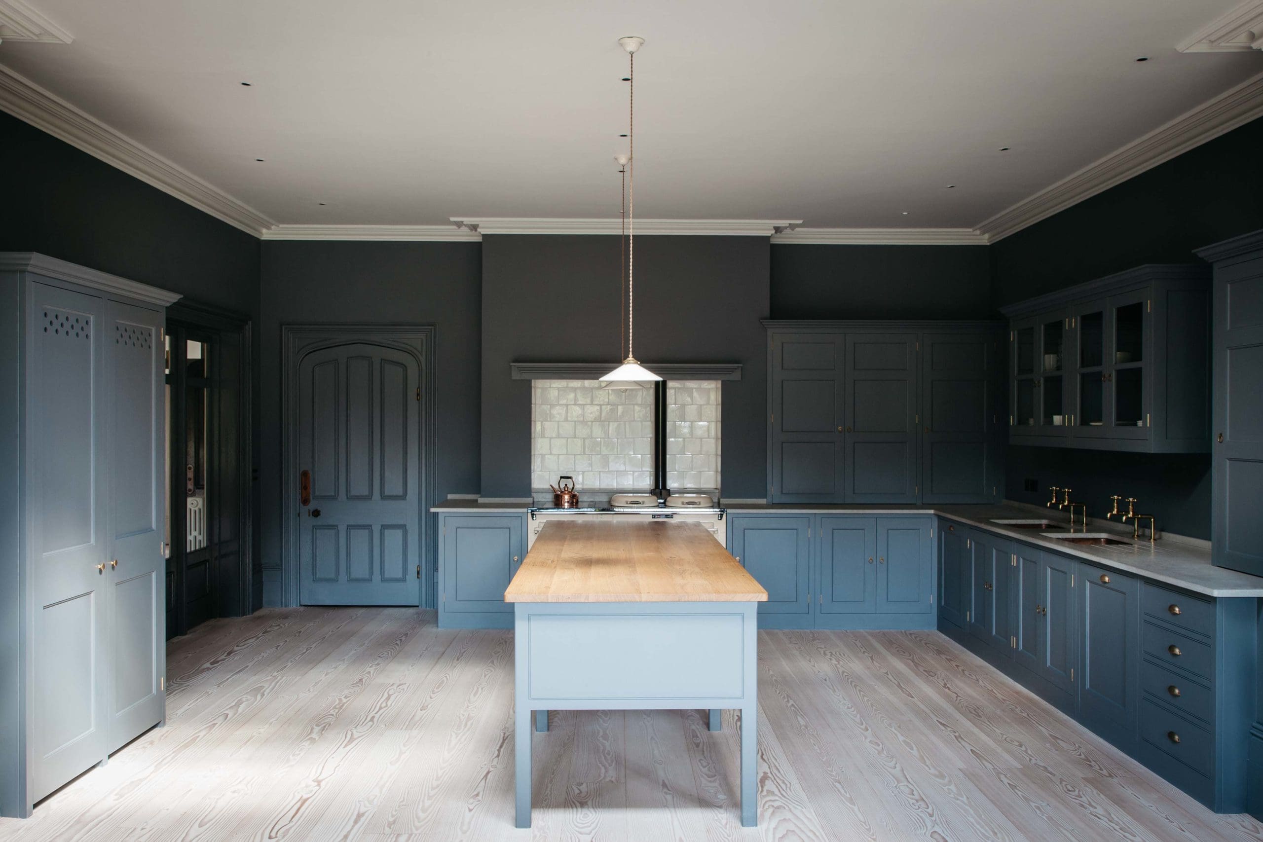  Duck egg blue wooden kitchen with white countertops