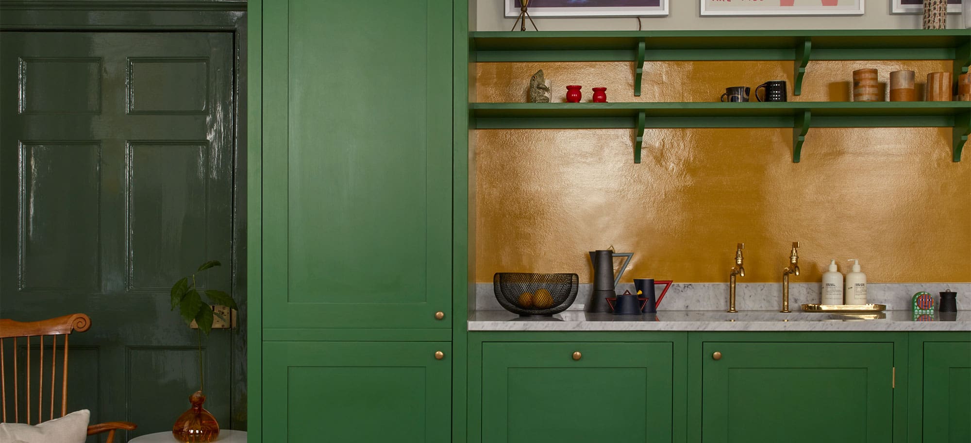  Deep green kitchen with yellow gold splashback by plain english design